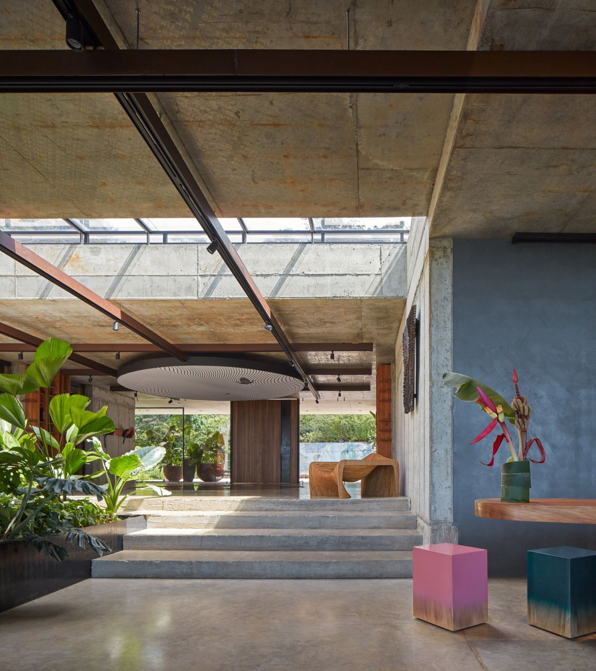 Concrete interior with tropical greenery