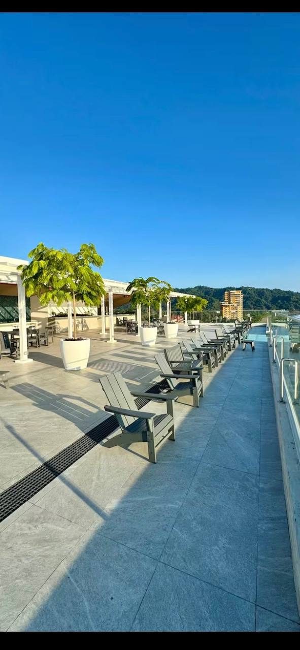 Long pool deck with loungers