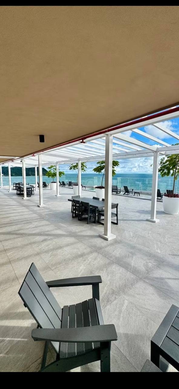 Rooftop terrace seating area facing the sea