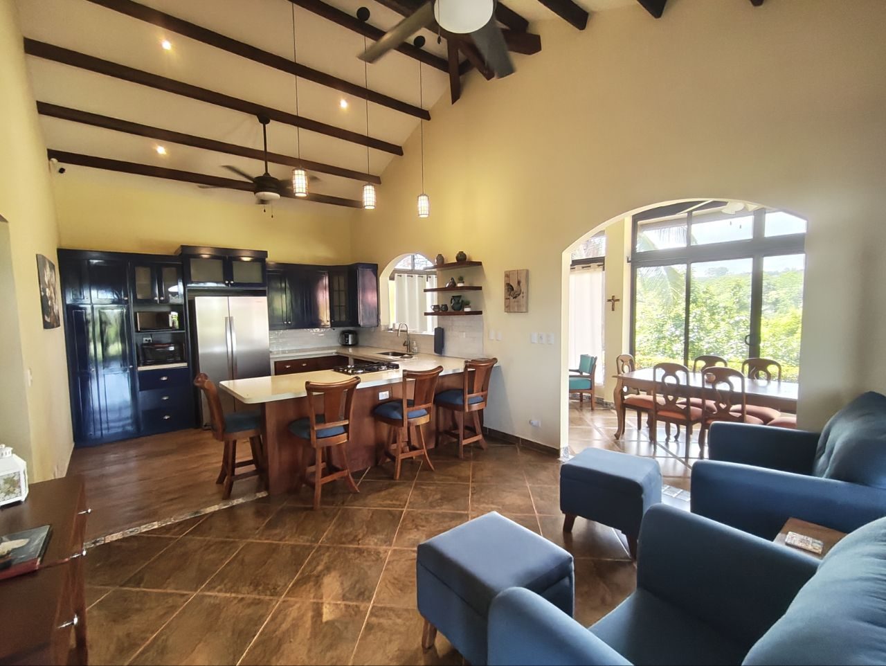 Living and dining area under vaulted ceilings