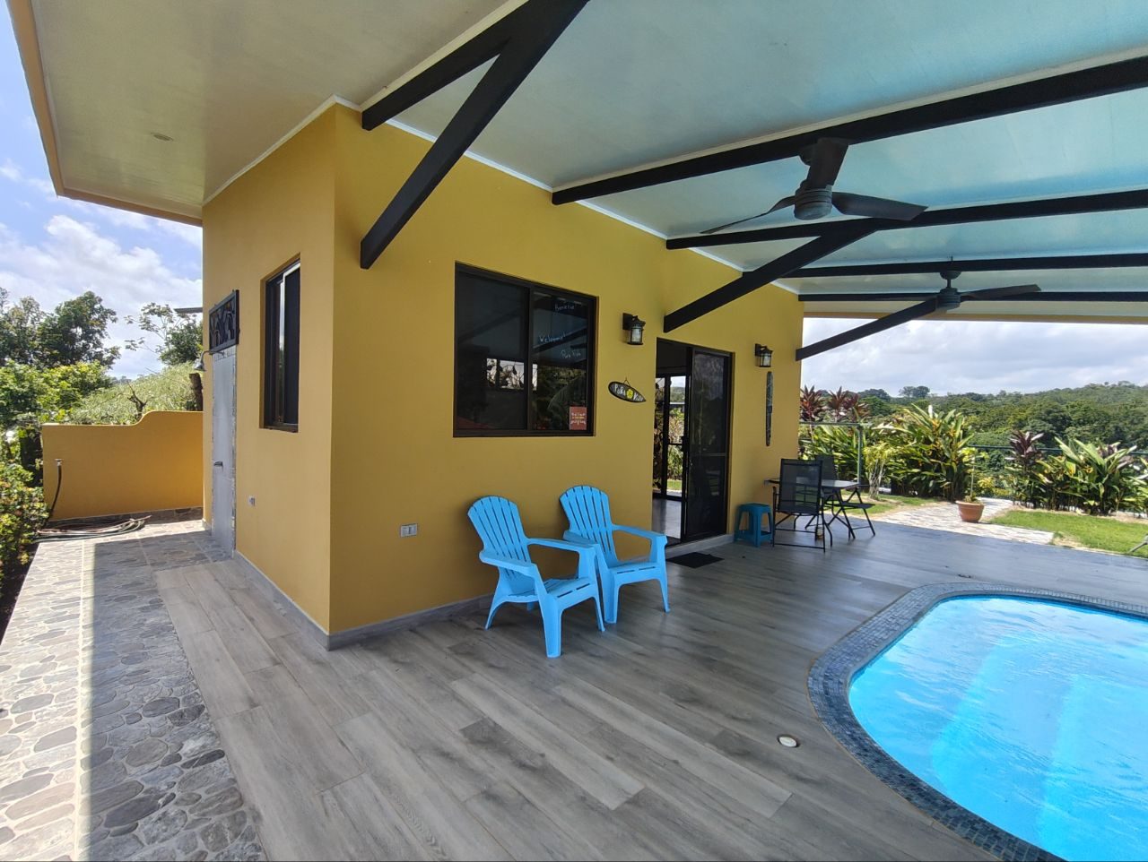 Shaded lounge area next to the pool