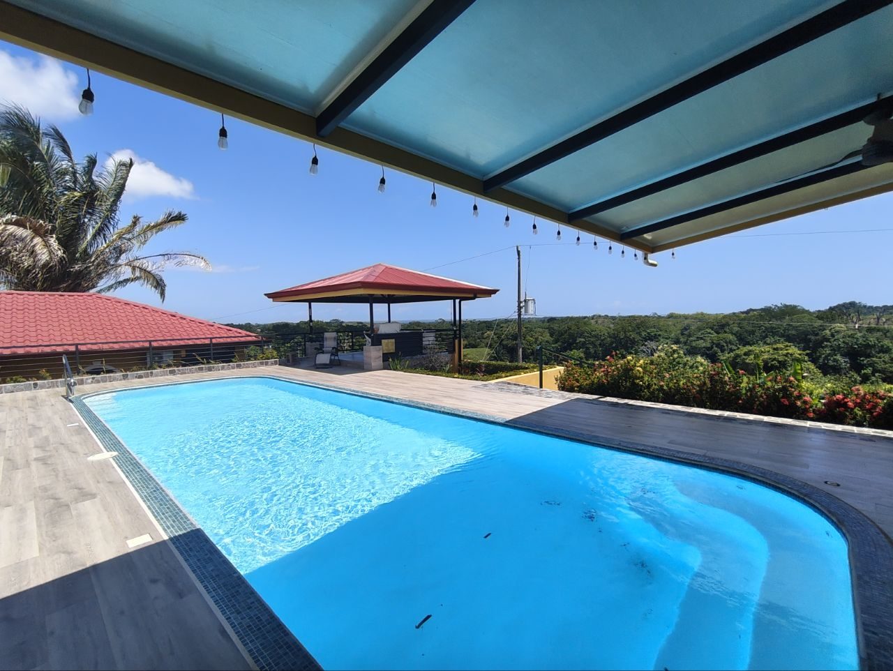 Pool terrace with covered pergola